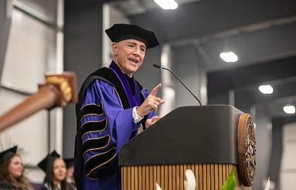 AU President Carlos Campo speaking at 2024 commencement